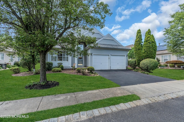 12 Drayton Rd, Manchester, NJ 08759 - view of property hidden behind natural elements featuring an attached garage, driveway, and a front lawn