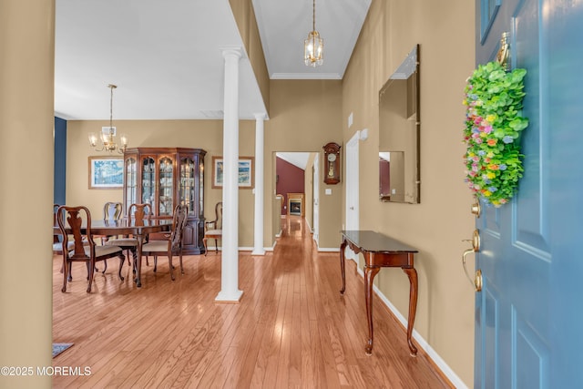 12 Drayton Rd, Manchester, NJ 08759 - entryway featuring a chandelier, decorative columns, light wood-type flooring, and ornamental molding