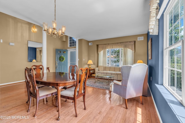 12 Drayton Rd, Manchester, NJ 08759 - dining room with a chandelier and light wood-style flooring