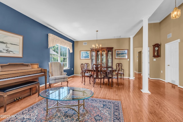 12 Drayton Rd, Manchester, NJ 08759 - living room with decorative columns, wood finished floors, and a chandelier