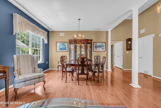 12 Drayton Rd, Manchester, NJ 08759 - dining area featuring decorative columns, hardwood / wood-style floors, and a chandelier