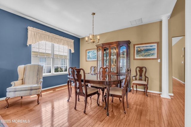 12 Drayton Rd, Manchester, NJ 08759 - dining room with a chandelier, ornate columns, and light wood finished floors