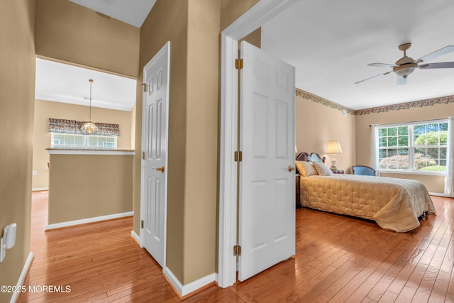 12 Drayton Rd, Manchester, NJ 08759 - bedroom with light wood-type flooring, a ceiling fan, and a chandelier