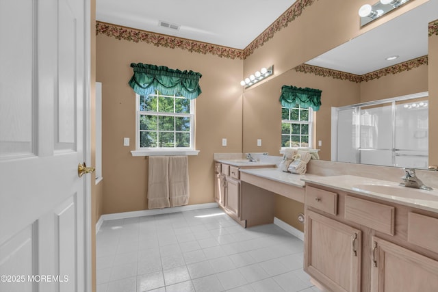 12 Drayton Rd, Manchester, NJ 08759 - full bathroom with plenty of natural light, double vanity, a shower stall, and tile patterned floors