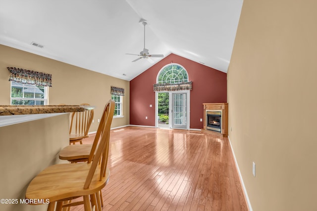 12 Drayton Rd, Manchester, NJ 08759 - unfurnished living room featuring ceiling fan, light wood finished floors, a glass covered fireplace, and high vaulted ceiling