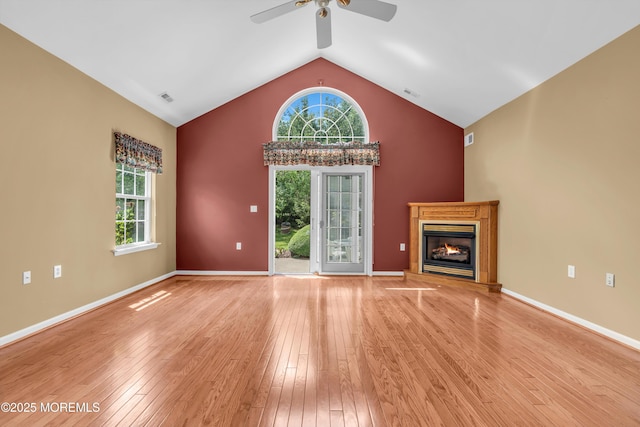 12 Drayton Rd, Manchester, NJ 08759 - unfurnished living room with ceiling fan, vaulted ceiling, light wood-type flooring, plenty of natural light, and a glass covered fireplace