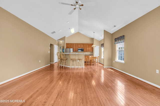 12 Drayton Rd, Manchester, NJ 08759 - living room with ceiling fan, high vaulted ceiling, and light wood-style flooring