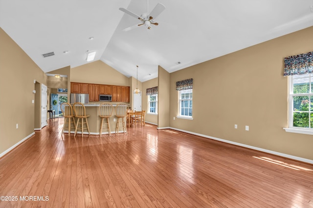 12 Drayton Rd, Manchester, NJ 08759 - unfurnished living room with ceiling fan, light wood finished floors, and high vaulted ceiling
