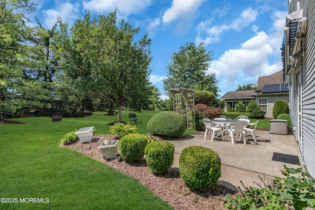 12 Drayton Rd, Manchester, NJ 08759 - view of green lawn with a patio and outdoor dining space