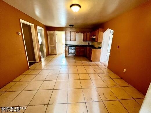 80 Seeley Ave, Keansburg, NJ 07734 - kitchen featuring dark countertops and light tile patterned flooring