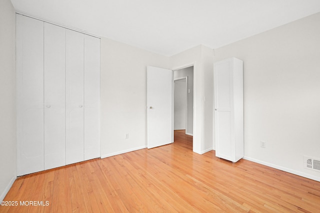 3 Dublin Ln, Hazlet, NJ 07730 - unfurnished bedroom featuring light wood finished floors and a closet