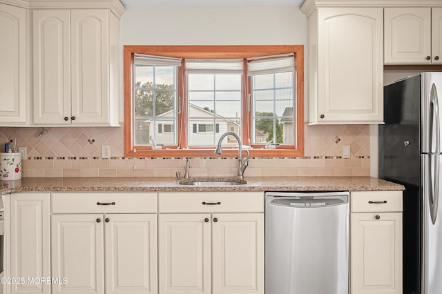 3 Dublin Ln, Hazlet, NJ 07730 - kitchen featuring appliances with stainless steel finishes, backsplash, plenty of natural light, and light stone countertops