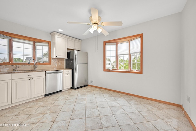 3 Dublin Ln, Hazlet, NJ 07730 - kitchen featuring appliances with stainless steel finishes, plenty of natural light, tasteful backsplash, light stone countertops, and recessed lighting
