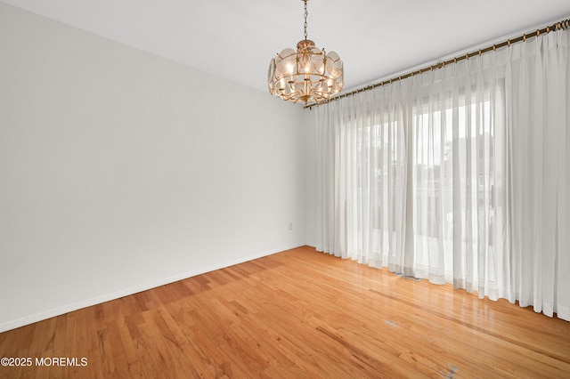 3 Dublin Ln, Hazlet, NJ 07730 - unfurnished room featuring a chandelier and light wood-style floors