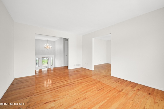 3 Dublin Ln, Hazlet, NJ 07730 - empty room featuring a chandelier and wood-type flooring