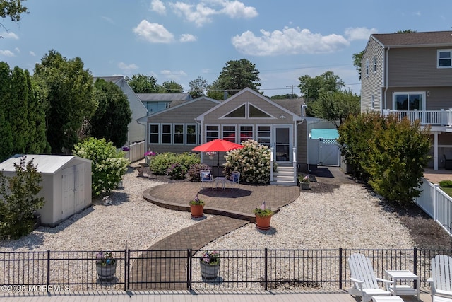52 Kettle Creek Dr, Brick, NJ 08723 - back of property featuring a fenced backyard, a shed, a gate, and a patio