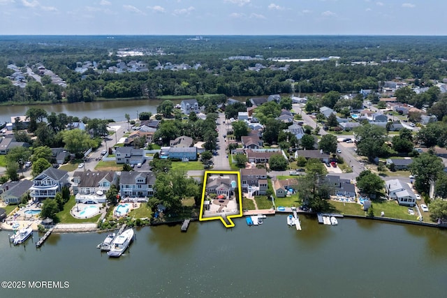 52 Kettle Creek Dr, Brick, NJ 08723 - aerial view of residential area with property boundaries highlighted and a nearby body of water