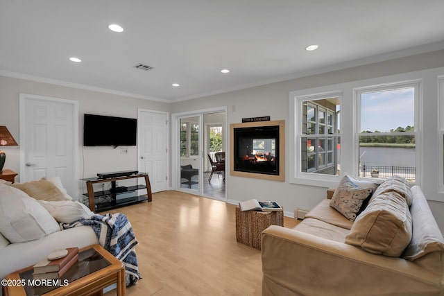 52 Kettle Creek Dr, Brick, NJ 08723 - living room featuring light wood-type flooring, crown molding, baseboard heating, and recessed lighting