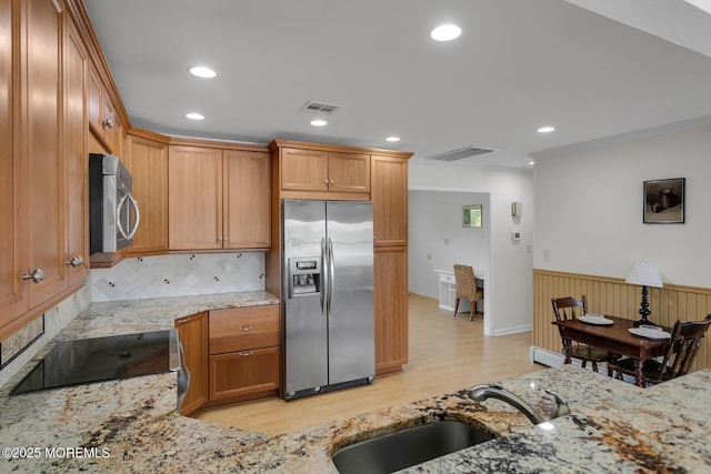 52 Kettle Creek Dr, Brick, NJ 08723 - kitchen featuring stainless steel appliances, light wood-style floors, light stone countertops, wainscoting, and recessed lighting
