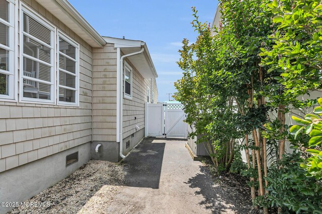 52 Kettle Creek Dr, Brick, NJ 08723 - view of home's exterior with a gate and crawl space
