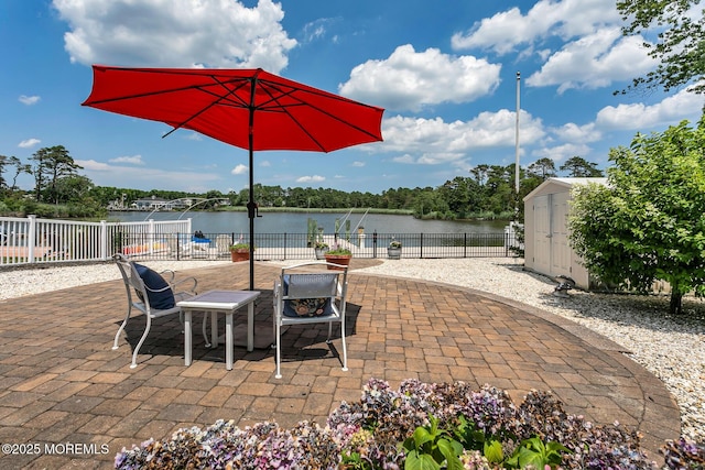 52 Kettle Creek Dr, Brick, NJ 08723 - view of patio / terrace with a shed and a water view