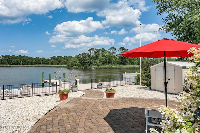 52 Kettle Creek Dr, Brick, NJ 08723 - view of patio / terrace featuring a storage unit and a water view