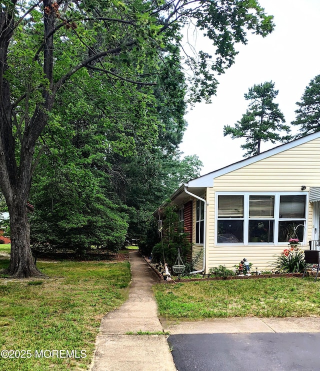 4 Snowberry Ln Unit D, Whiting, NJ 08759 - view of property exterior with a yard