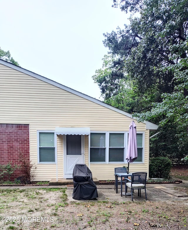 4 Snowberry Ln Unit D, Whiting, NJ 08759 - rear view of property featuring a patio