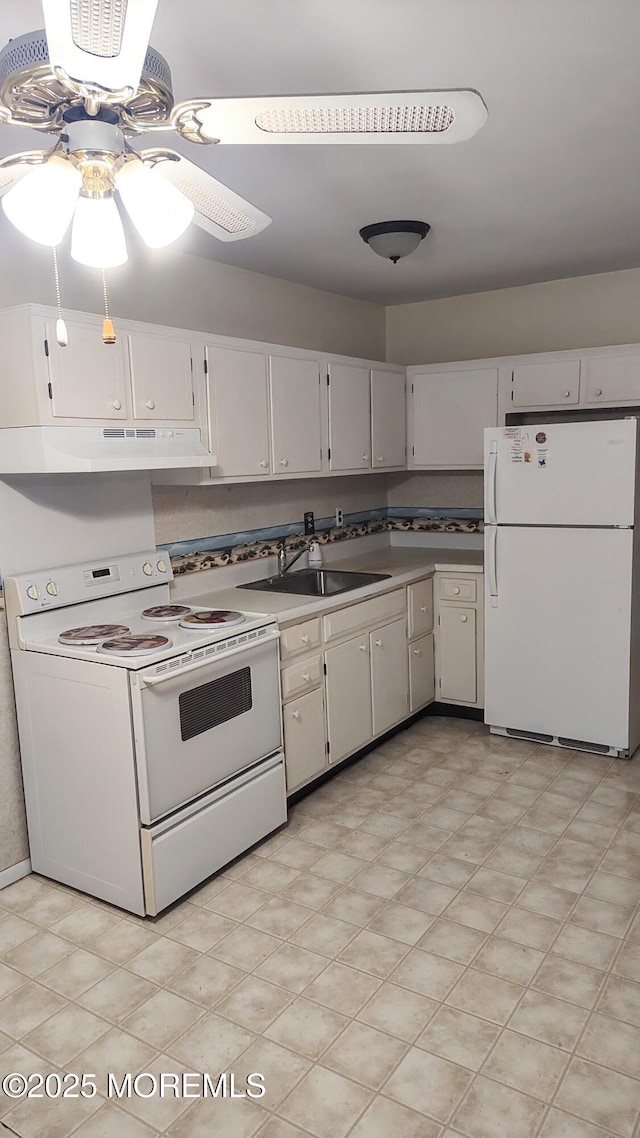 4 Snowberry Ln Unit D, Whiting, NJ 08759 - kitchen with white appliances, under cabinet range hood, white cabinetry, a ceiling fan, and light floors