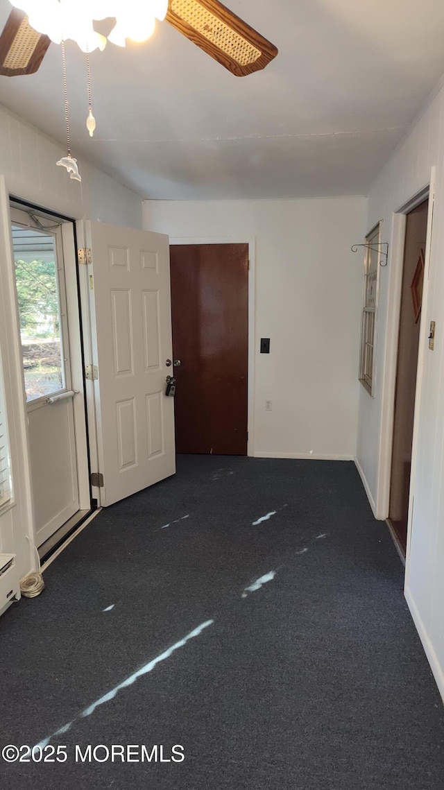 4 Snowberry Ln Unit D, Whiting, NJ 08759 - empty room with dark colored carpet and ceiling fan
