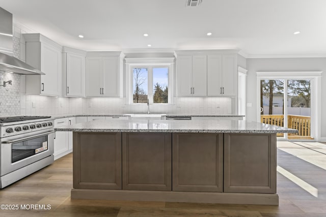 837 Naryshkin Way, Toms River, NJ 08753 - kitchen featuring stainless steel appliances, wall chimney range hood, white cabinets, backsplash, and ornamental molding