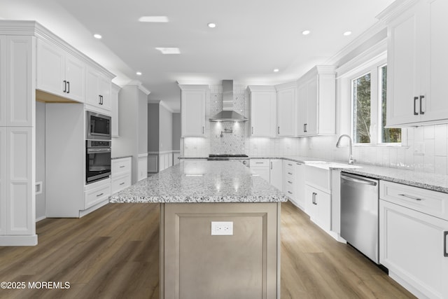 837 Naryshkin Way, Toms River, NJ 08753 - kitchen with wall chimney range hood, appliances with stainless steel finishes, ornamental molding, a kitchen island, and white cabinets