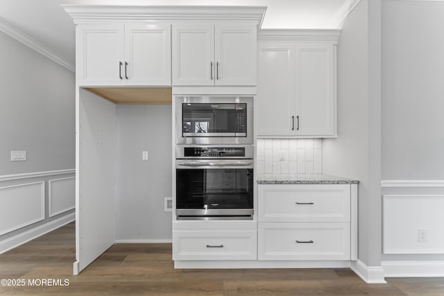837 Naryshkin Way, Toms River, NJ 08753 - kitchen featuring appliances with stainless steel finishes, light stone counters, white cabinetry, crown molding, and dark wood-type flooring