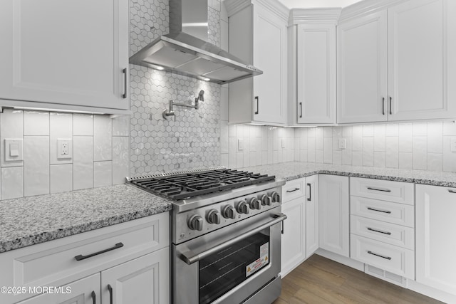 837 Naryshkin Way, Toms River, NJ 08753 - kitchen with stainless steel range, wall chimney range hood, backsplash, white cabinets, and light stone counters