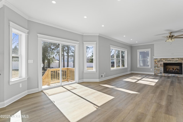 837 Naryshkin Way, Toms River, NJ 08753 - unfurnished living room featuring wood finished floors, crown molding, recessed lighting, ceiling fan, and a stone fireplace