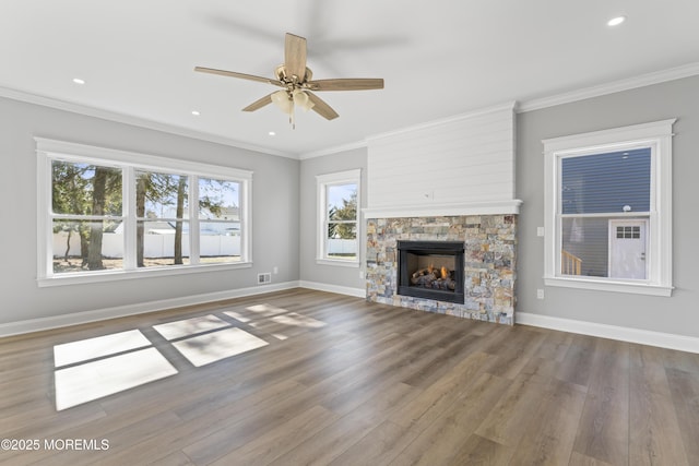 837 Naryshkin Way, Toms River, NJ 08753 - unfurnished living room with wood finished floors, a ceiling fan, a stone fireplace, ornamental molding, and recessed lighting