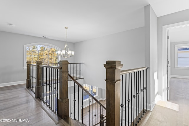 837 Naryshkin Way, Toms River, NJ 08753 - hall with an upstairs landing, wood finished floors, and a chandelier
