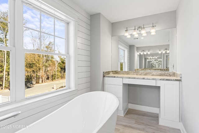 837 Naryshkin Way, Toms River, NJ 08753 - bathroom with a freestanding tub, vanity, and wood finished floors