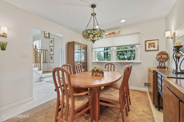 58 Old Bridge Dr, Howell, NJ 07731 - dining space with stairway and light tile patterned flooring