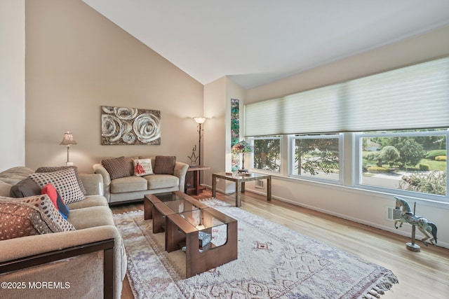 58 Old Bridge Dr, Howell, NJ 07731 - living area with wood finished floors, plenty of natural light, and vaulted ceiling