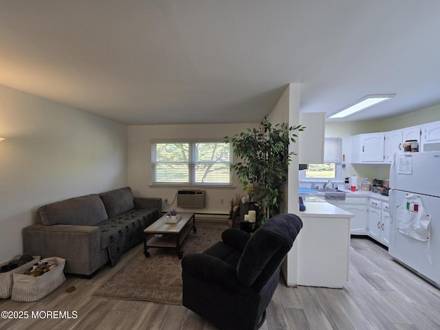 5 Potomac Ln Unit D, Whiting, NJ 08759 - living area with light wood finished floors and a wall mounted AC