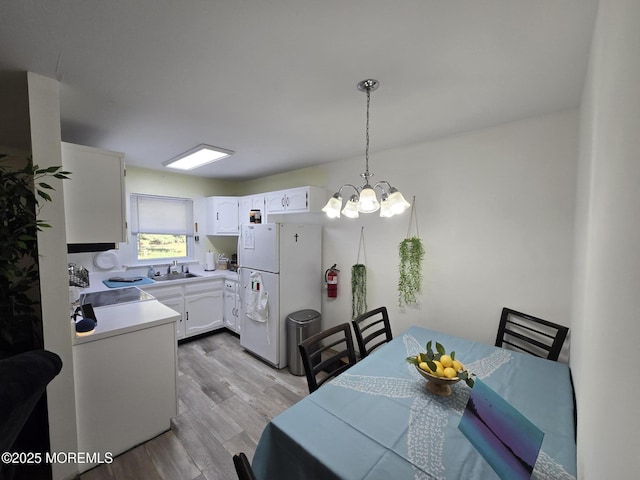 5 Potomac Ln Unit D, Whiting, NJ 08759 - dining area with light wood-type flooring and a chandelier