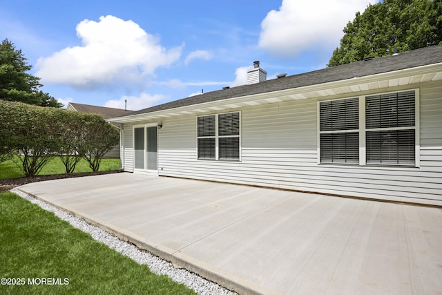 12 Weston Ct, Marlboro, NJ 07746 - back of property featuring a patio and a chimney