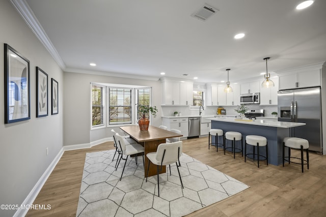 12 Weston Ct, Marlboro, NJ 07746 - dining space featuring crown molding, recessed lighting, and light wood finished floors