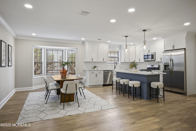 12 Weston Ct, Marlboro, NJ 07746 - dining space featuring ornamental molding, recessed lighting, and light wood-style flooring
