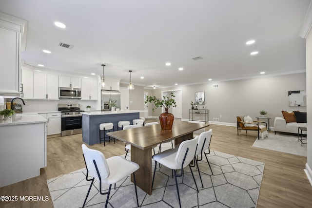 12 Weston Ct, Marlboro, NJ 07746 - dining area featuring ornamental molding, recessed lighting, and light wood-style floors
