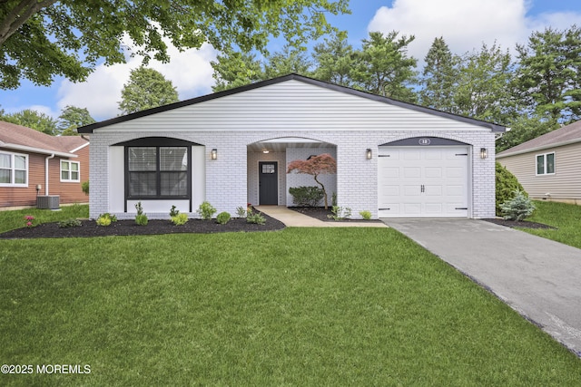12 Weston Ct, Marlboro, NJ 07746 - view of front of house with brick siding, concrete driveway, a front yard, and a garage