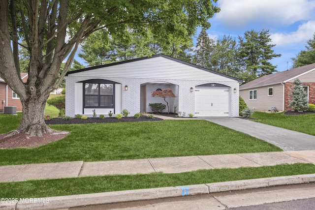 12 Weston Ct, Marlboro, NJ 07746 - view of front of home featuring a front lawn, a garage, concrete driveway, and brick siding