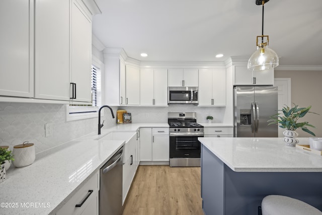 12 Weston Ct, Marlboro, NJ 07746 - kitchen featuring appliances with stainless steel finishes, white cabinetry, light stone counters, tasteful backsplash, and crown molding