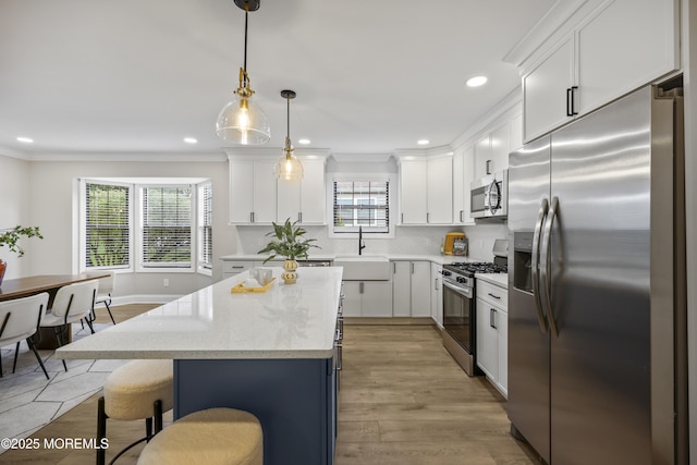 12 Weston Ct, Marlboro, NJ 07746 - kitchen featuring stainless steel appliances, a kitchen island, white cabinetry, recessed lighting, and decorative light fixtures